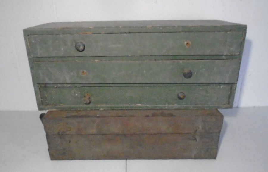 A vintage set of industrial wooden drawers and a small wooden trunk/chest