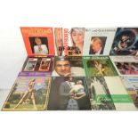 A quantity of 12" vinyl records including Debbie Harry, The Manhattan Transfer, Boney M, Status Quo,