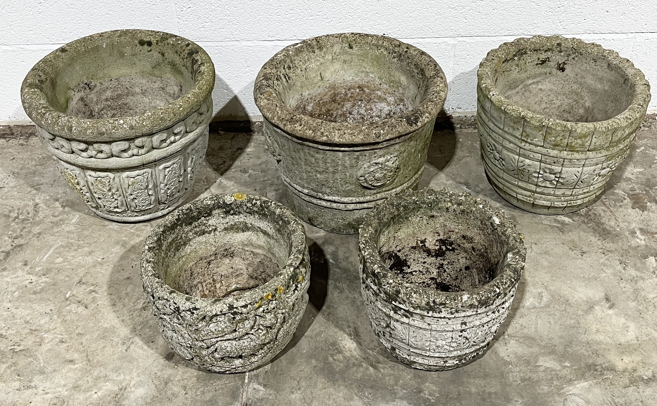 A collection of concrete garden pots