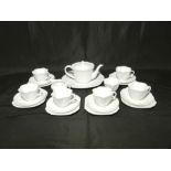 A Shelley white tea set consisting of six trios, large plate, tea pot, bowl and jug