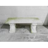 A reconstituted stone garden bench - length 115cm
