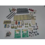 A collection of mainly Tri-ang Minic ships harbour accessories including quay straights, ocean