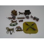 A collection of various tinplate and metal toys including a rocking horse, hens pecking, horse and
