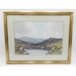 A framed watercolour of a moorland scene signed R D Sherrin - 40cm x 51cm