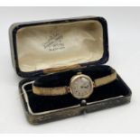 A Victorian 9ct gold watch on 9ct gold strap, total weight including movement 17.7g