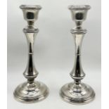 A pair of hallmarked silver candlesticks, Birmingham 1957, height 25cm