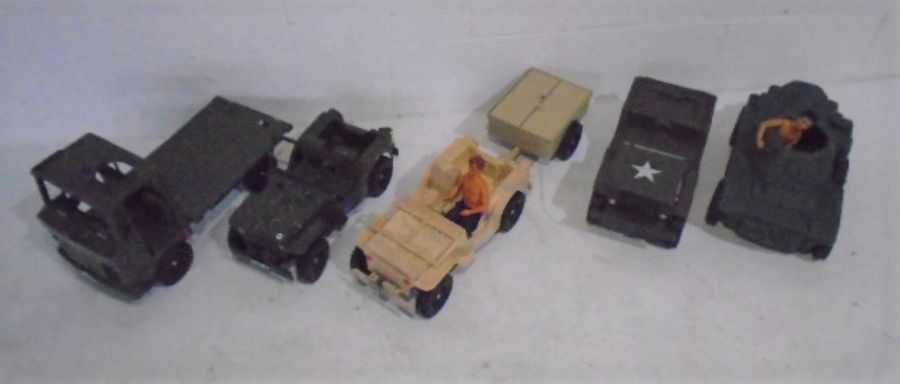 A collection of five large toy army vehicles including a Cherila Toys jeep, Arwin tank etc along