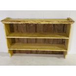 A painted pine wall hanging shelving unit - overall size 110cm x 73cm