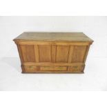 An antique oak mule chest with three drawers under - length 140cm, depth 56cm, height 82cm