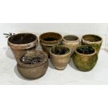 A collection of large terracotta flowerpots