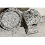 A small sectional granite pagoda and yin-yang birdbath