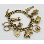 A 9ct gold charm bracelet with a collection of various charms including articulated examples,