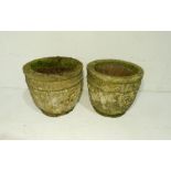 A pair of reconstituted stone garden pots