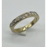 An 18ct white gold (unmarked) half eternity ring set with 7 diamonds