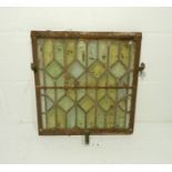 A metal framed leaded stained glass window (A/F) - 48cm x 46cm