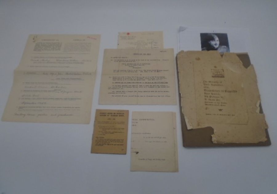 A small ephemera collection including World War 2 Jersey red cross papers plus a set of six photos