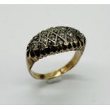 An antique 9ct gold (tested) ring set with 16 diamonds, weight 6.3g