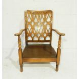 An Edwardian armchair with fretwork detailing to back (no cushion)