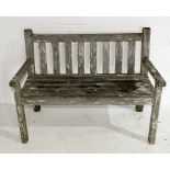 A weathered garden bench made by John Bright