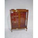 A walnut veneered display cabinet on cabriole legs - height 127cm, width 87cm, depth 33cm