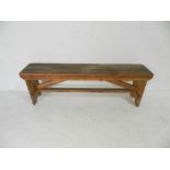 An industrial wooden bench - from Axminster carpets - length 158cm, depth 32cm, height 51cm