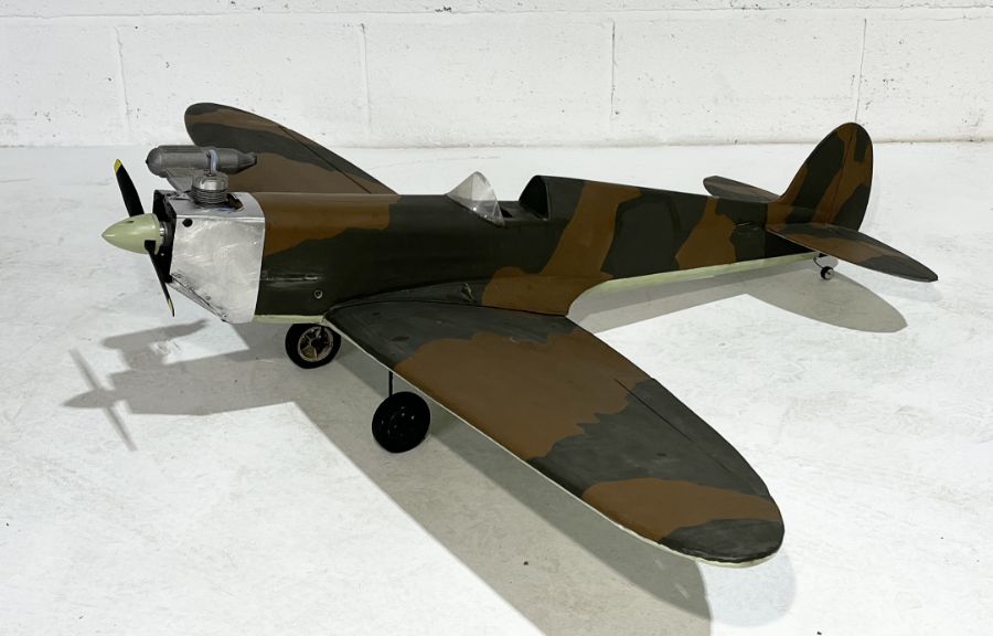 A vintage hand built radio controlled model of a Spitfire, wingspan 140cm, no controller present