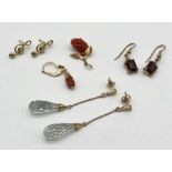 A collection of earrings- crystal drops in 14ct gold, a pair of garnet earrings in 9ct gold, 9ct