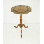 A French occasional table inlaid with floral decoration and ormolu mounts