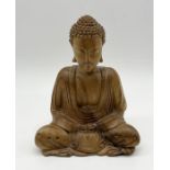 A carved wooden seated Buddha - height 20cm