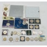 A collection of various coinage including commemorative crowns