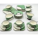A Royal Doulton "De Luxe" Art deco tea set comprising 2 side plates, sugar bowl, milk jug, 9 cups,
