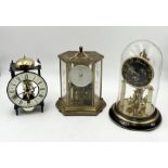 A collection of three clocks including anniversary clock etc.