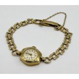 A ladies 9ct gold Rotary wristwatch with 9ct strap, total weight including movement 13.8g