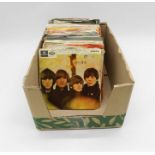 A quantity of 7" vinyl records including The Beatles, The Rolling Stones, The Monkees, The Kinks,