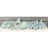 A large collection of Poole Pottery dinner and tea ware including dinner plates, teapot, jugs, cups,