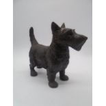 A vintage cast iron door stop in the form of a Scottish terrier. Height 23cm, length 28cm.
