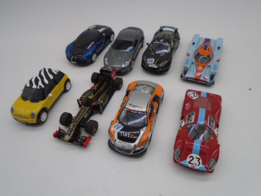 A collection of eight vintage Hornby Scalextric cars including an Aston Martin, Lotus Evora, Lotus