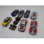 A collection of eight vintage Hornby Scalextric cars including an Aston Martin, Lotus Evora, Lotus