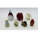 A collection of seven glass paperweights in the form of animals including an elephant, rabbit,