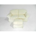 A two seater sofa with loose covers along with a pouffe - length 188cm