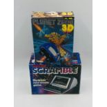 A boxed retro Grandstand Scramble electronic mini arcade game, along with a boxed Tomy Tronic Planet