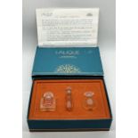 A boxed set of three Lalique Glass Ultimate Collection miniature scent bottles