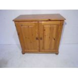 A pine two door cupboard - height cm, width 84cm, depth 39cm