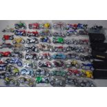 A large collection of Maisto plastic motorcycles with stands