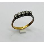 An 18ct gold and platinum diamond five stone ring