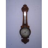 A Thomas Wallis & Co Ltd (Holban Circus) oak barometer with carved detailing - approx. height 83cm