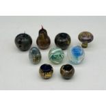 A collection of nine glass paperweight including Isle of Wight Glass, some in the form of fruit (