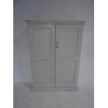 A painted pine two door cupboard - height 138cm, width 98cm, depth 34cm