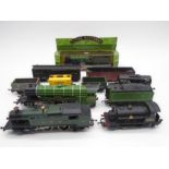 A collection of unboxed model railway OO gauge locomotives and rolling stock including a Mainline