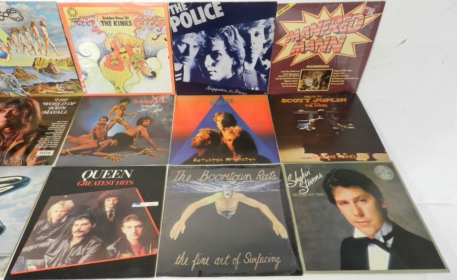 A quantity of 12" and 7" vinyl records including The Who, The Beatles, The Doors, Elvis Costello and - Image 4 of 7